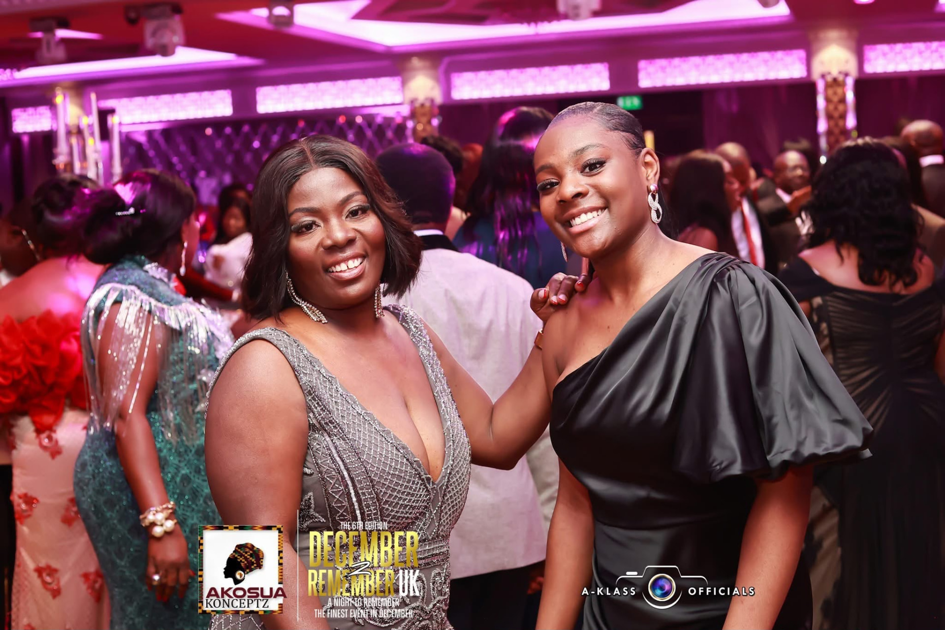 Friends in silver and black gowns celebrating together