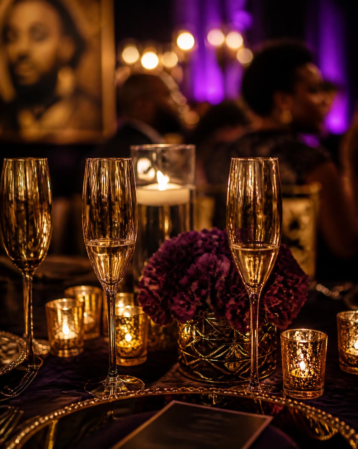 Gold glassware and candlelight at an Akosua Konceptz table setting